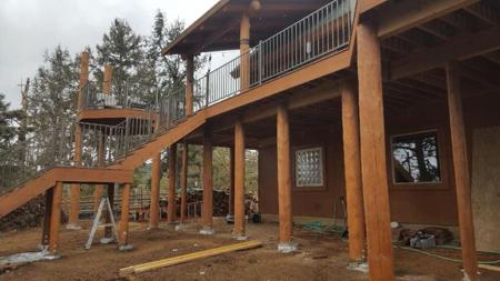 Custom deck wrap around deck with 10” log posts from Colorado Springs Deck Builder