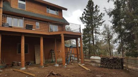 Custom deck wrap around deck with 10” log posts from Colorado Springs Deck Builder